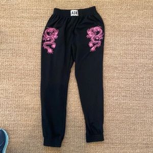Adika woman’s small never worn black sweatshirt with pink dragons